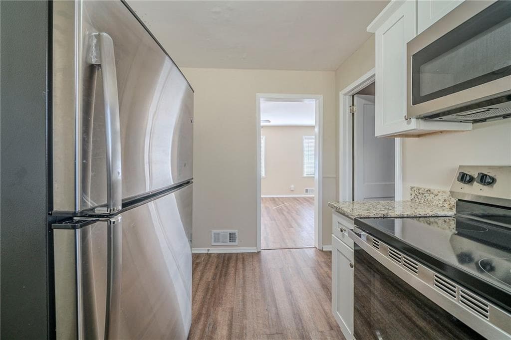 4 bedroom, 3 bathroom, 1,334 sq ft single family residence for sale at 1433 Dennis Drive, Decatur, GA 30032 — photo 3