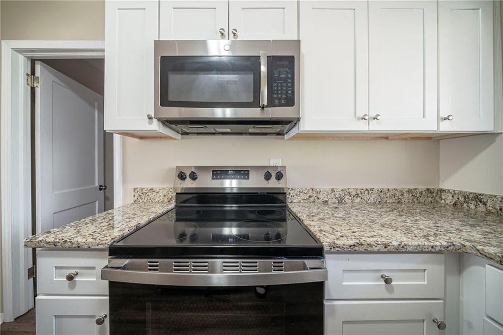 4 bedroom, 3 bathroom, 1,334 sq ft single family residence for sale at 1433 Dennis Drive, Decatur, GA 30032 — photo 4