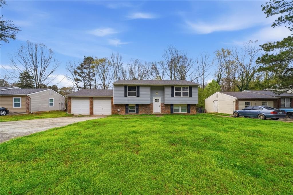4 bedroom, 2 bathroom, 1,020 sq ft single family residence for sale at 6865 Kimberly Mill Road, Atlanta, GA 30349 — photo 1 of 25