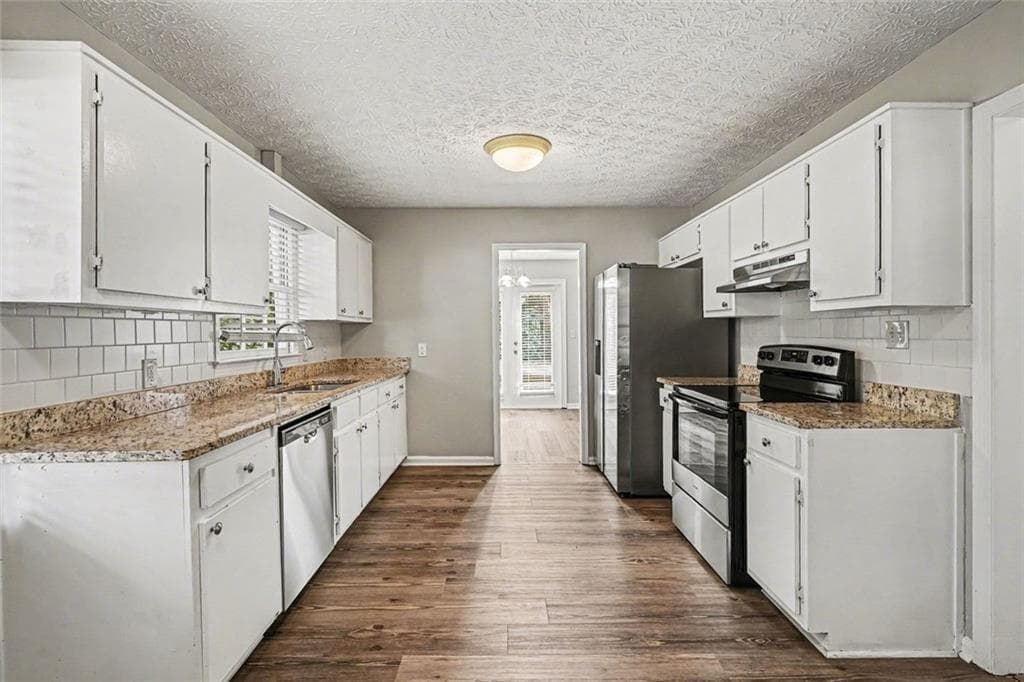 3 bedroom, 2 bathroom, 1,556 sq ft single family residence for sale at 2060 Lost Forest Lane, Conyers, GA 30094 — photo 3