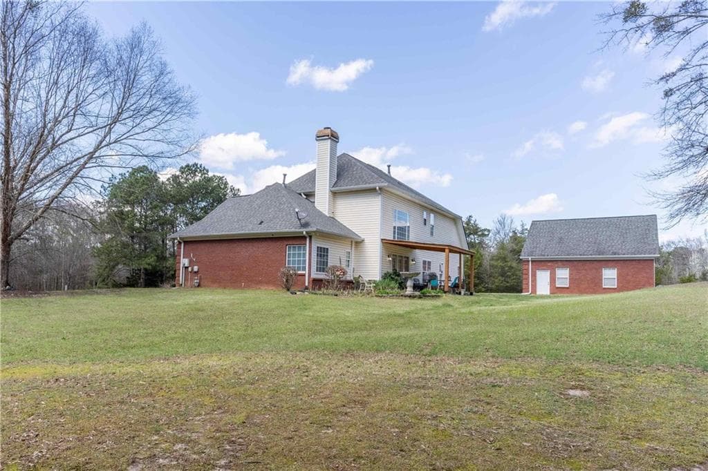 4 bedroom, 4 bathroom, 2,769 sq ft single family residence for sale at 2101 Indian Shoals Road, Loganville, GA 30052 — photo 2