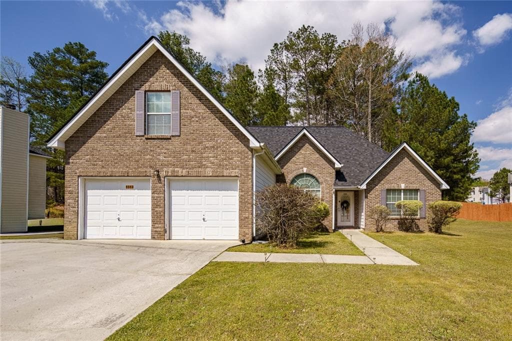 4 bedroom, 4 bathroom single family residence for sale at 6869 Fireside Lane, Atlanta, GA 30349 — photo 1 of 25