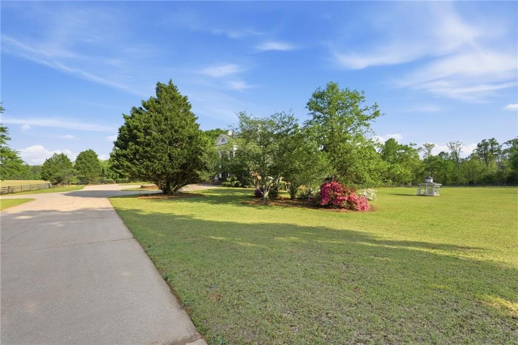 5 bedroom, 4 bathroom, 6,664 sq ft single family residence for sale at 1202 Hodges Circle, Mansfield, GA 30055 — photo 10
