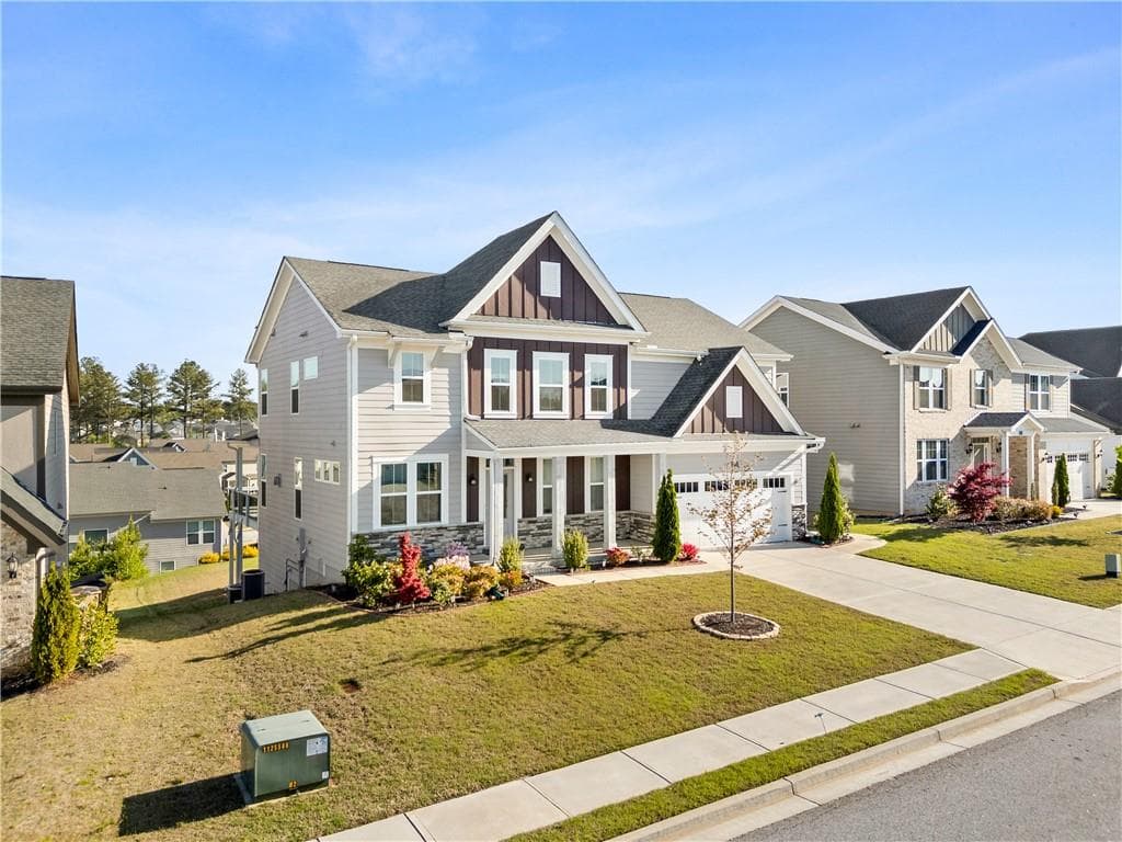6 bedroom, 4 bathroom, 4,124 sq ft single family residence under contract at 1033 Michigan Circle, Hoschton, GA 30548 — photo 2
