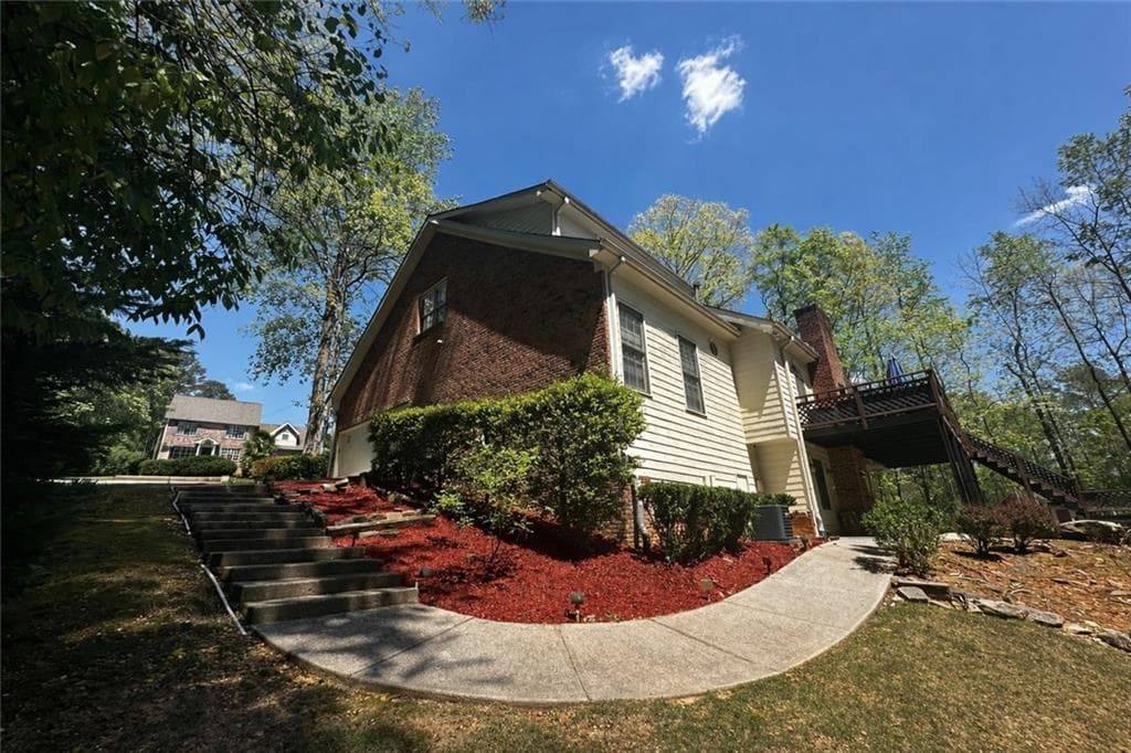 5 bedroom, 4 bathroom, 4,478 sq ft single family residence for sale at 4480 Moorings Lane, Snellville, GA 30039 — photo 3