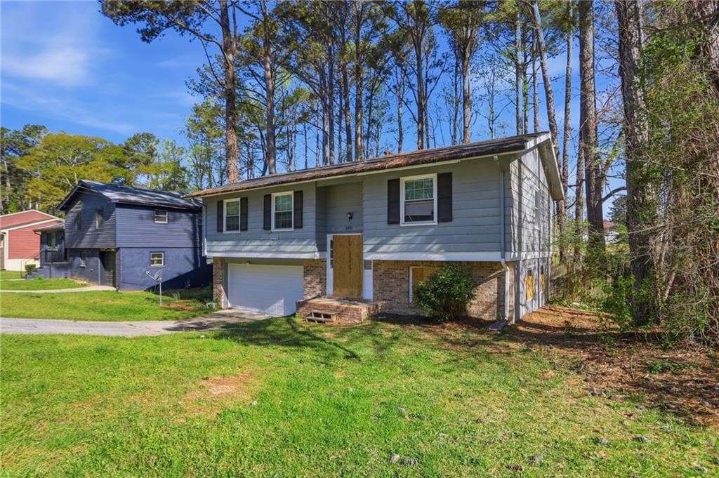 4 bedroom, 2 bathroom, 1,095 sq ft single family residence for sale at 6665 Hidden Brook Trail, Atlanta, GA 30349 — photo 2