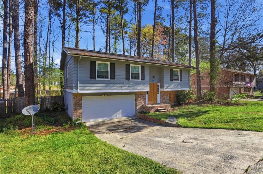 4 bedroom, 2 bathroom, 1,095 sq ft single family residence for sale at 6665 Hidden Brook Trail, Atlanta, GA 30349 — photo 3