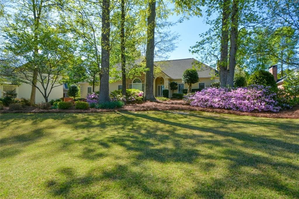 4 bedroom, 3 bathroom, 3,998 sq ft single family residence sold at 6085 Wellington Court, Cumming, GA 30040