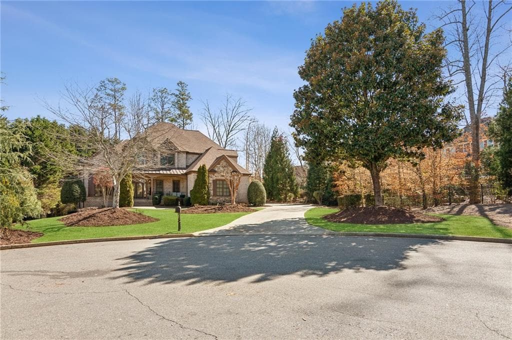 4 bedroom, 5 bathroom, 3,958 sq ft single family residence for sale at 5640 Copper Creek Pass, Cumming, GA 30040 — photo 2