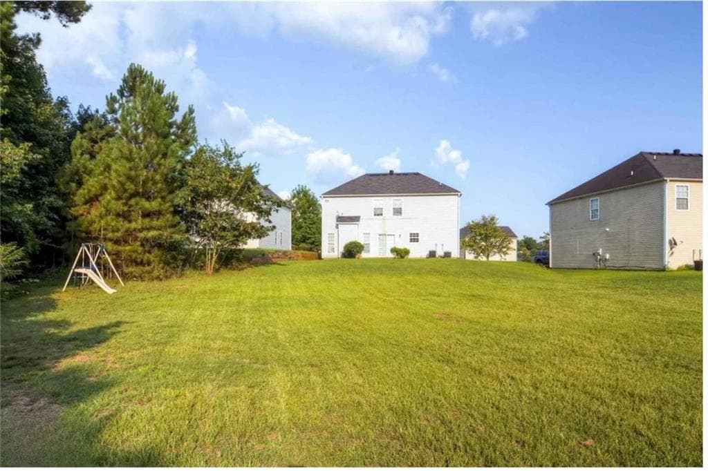 4 bedroom, 3 bathroom, 2,556 sq ft single family residence for sale at 5493 Wexford Pass, Atlanta, GA 30349 — photo 3