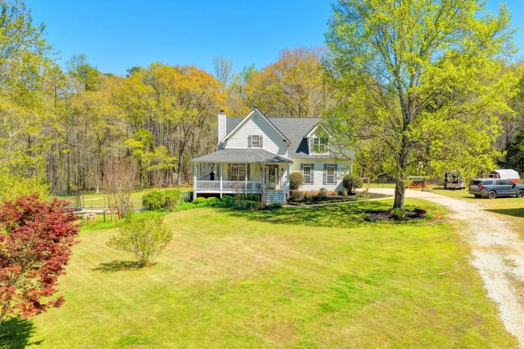 4 bedroom, 3 bathroom, 4,109 sq ft single family residence for sale at 1555 Lower River Road, Covington, GA 30016 — photo 2