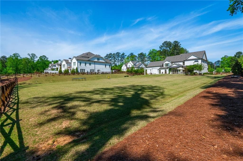 6 bedroom, 6 bathroom, 5,568 sq ft single family residence for sale at 4184 Thompson Mill Road, Buford, GA 30519 — photo 6