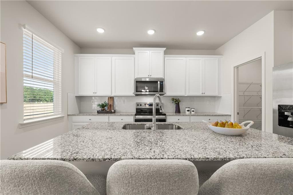 4 bedroom, 3 bathroom, 2,506 sq ft single family residence for sale at 1796 Kingsmere Run Drive, Loganville, GA 30052 — photo 8