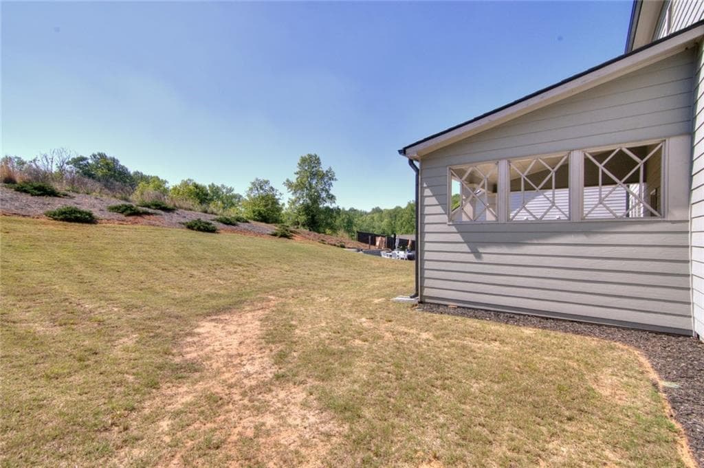 4 bedroom, 3 bathroom, 3,204 sq ft single family residence for sale at 7107 Branch Creek Cove, Flowery Branch, GA 30542 — photo 8