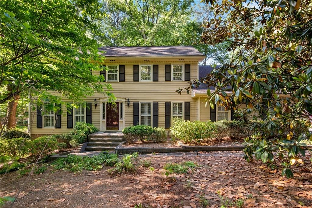 4 bedroom, 3 bathroom, 2,600 sq ft single family residence sold at 1717 Womack Road, Dunwoody, GA 30338