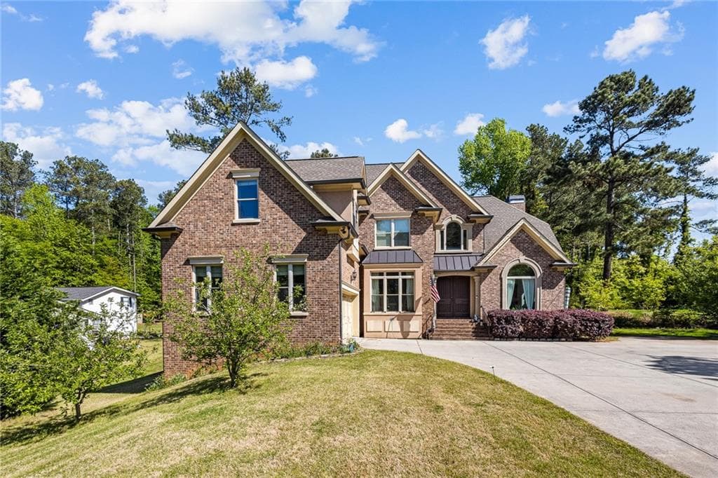 7 bedroom, 6 bathroom, 6,055 sq ft single family residence for sale at 1614 Rucker Road, Alpharetta, GA 30009 — photo 2