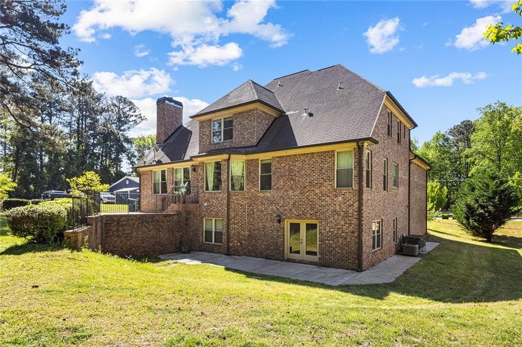 7 bedroom, 6 bathroom, 6,055 sq ft single family residence for sale at 1614 Rucker Road, Alpharetta, GA 30009 — photo 3