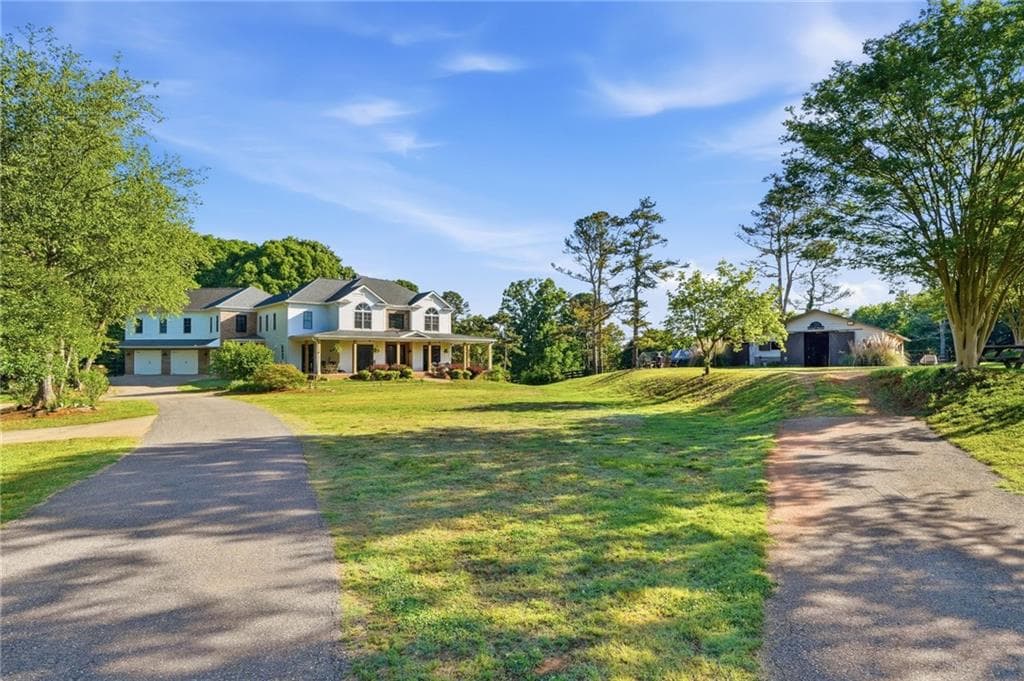 6 bedroom, 5 bathroom, 6,083 sq ft single family residence for sale at 3535 Dr Bramblett Road, Cumming, GA 30028 — photo 6
