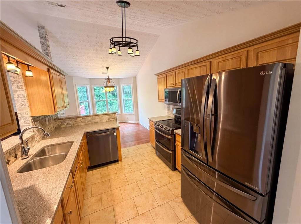 5 bedroom, 3 bathroom, 3,245 sq ft single family residence for sale at 3222 Keenly Ives Court, Buford, GA 30519 — photo 2