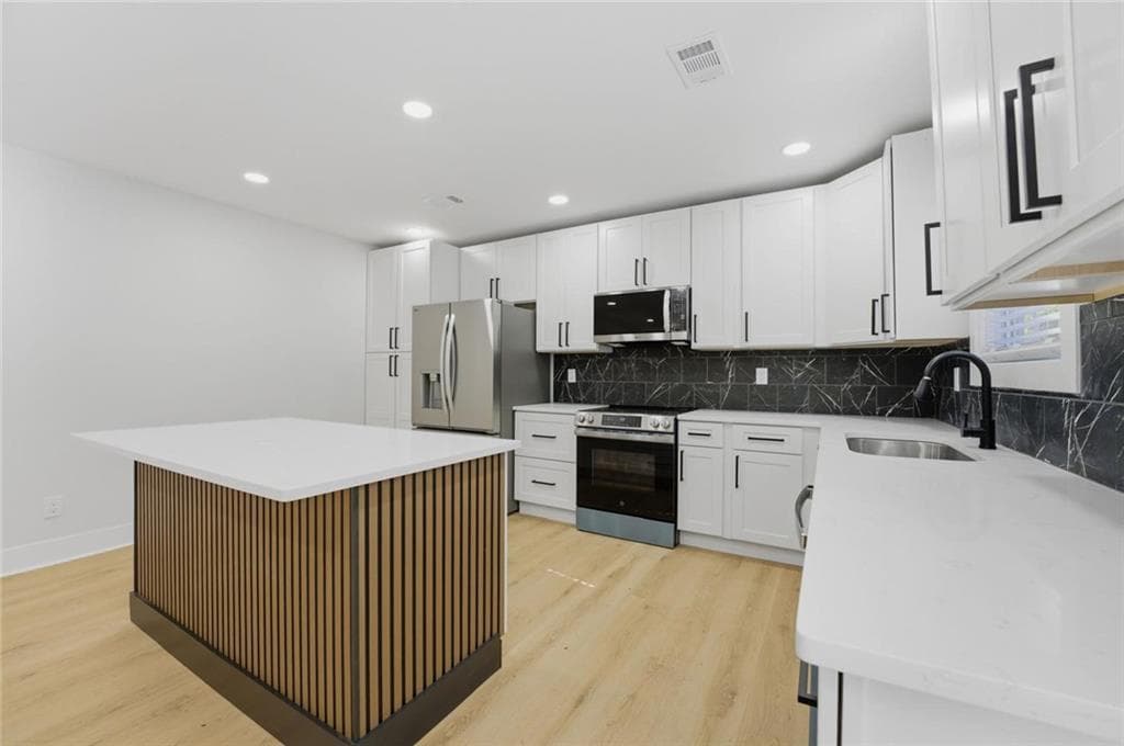 3 bedroom, 2 bathroom, 1,250 sq ft single family residence for sale at 2681 Oldknow Drive, Atlanta, GA 30318 — photo 4