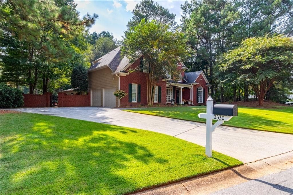 5 bedroom, 4 bathroom, 4,340 sq ft single family residence for sale at 2330 Ashbourne Drive, Lawrenceville, GA 30043 — photo 2