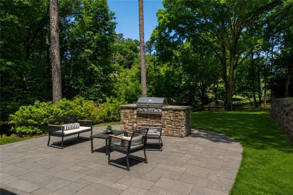 4 bedroom, 4 bathroom, 4,270 sq ft single family residence for sale at 9570 Huntcliff Trace, Sandy Springs, GA 30350 — photo 2