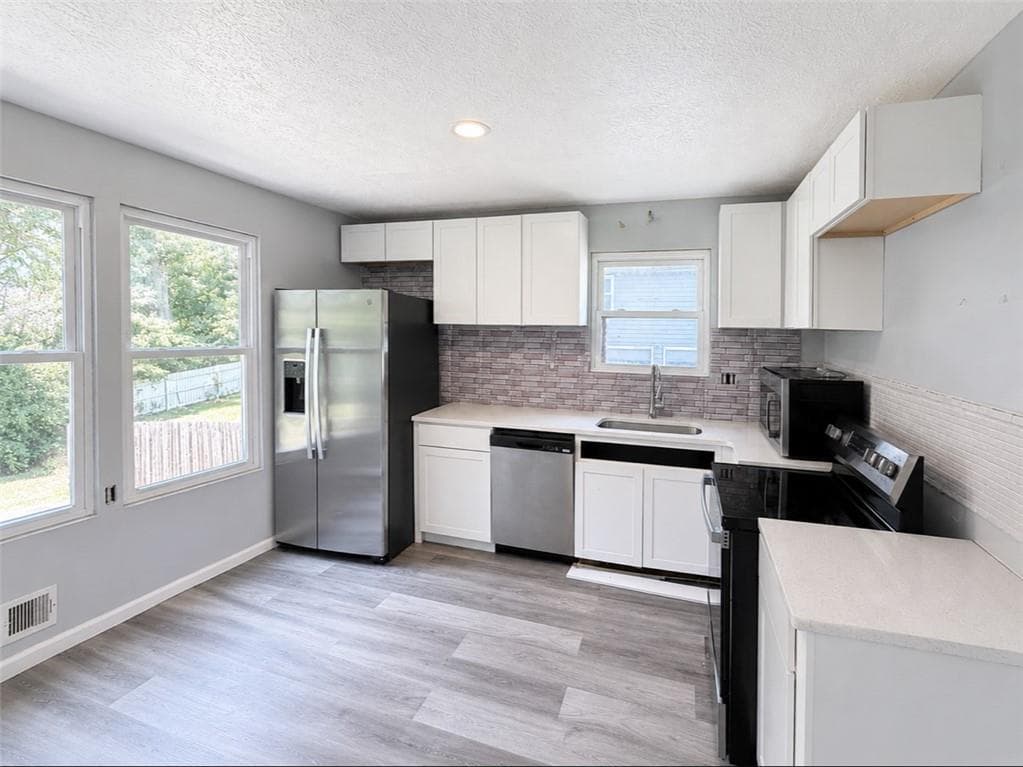 4 bedroom, 2 bathroom, 1,654 sq ft single family residence for sale at 1088 Nimblewood Way, Stone Mountain, GA 30088 — photo 2