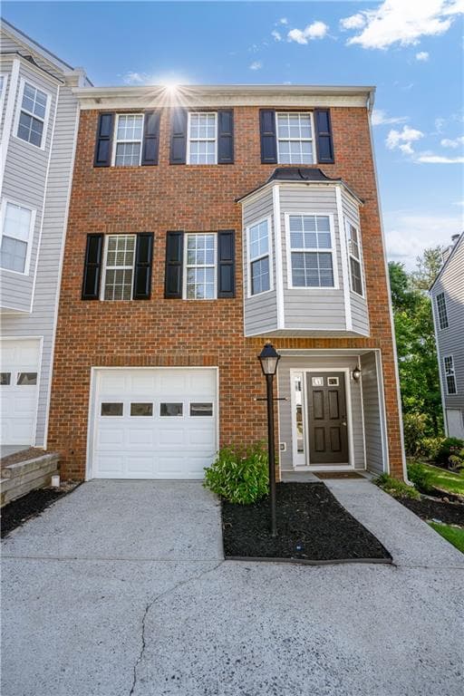 3 bedroom, 4 bathroom, 1,886 sq ft townhouse for sale at 1622 Indian Way, Cumming, GA 30040 — photo 1 of 55