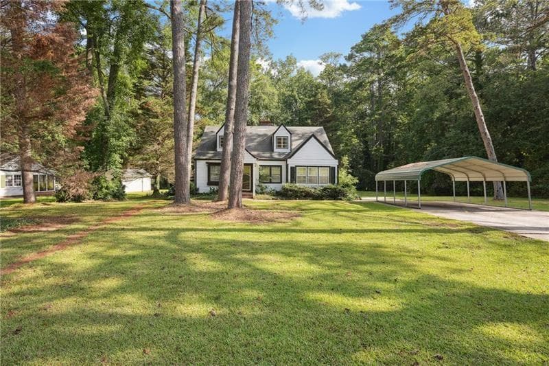 4 bedroom, 2 bathroom, 2,200 sq ft single family residence for sale at 30 Woodlawn Avenue, Hampton, GA 30228 — photo 2