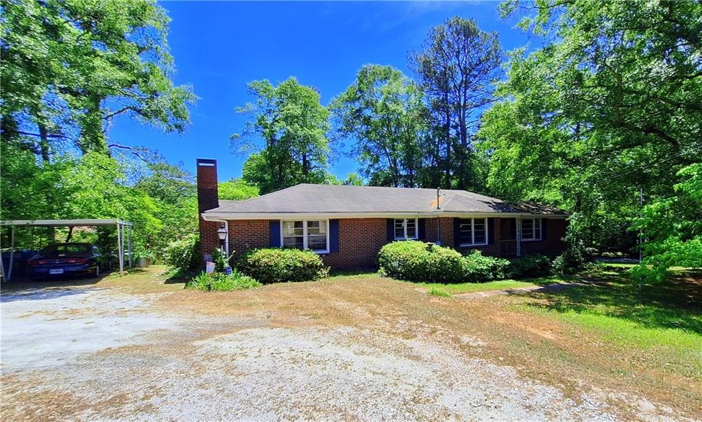 4 bedroom, 2 bathroom, 1,882 sq ft single family residence for sale at 1239 Milstead Avenue, Conyers, GA 30012 — photo 2
