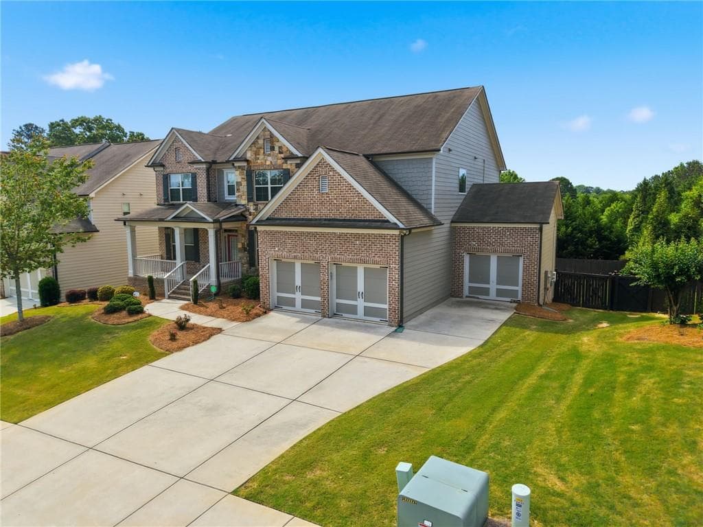 4 bedroom, 5 bathroom, 4,024 sq ft single family residence for sale at 2410 Wildlife Court, Buford, GA 30519 — photo 2