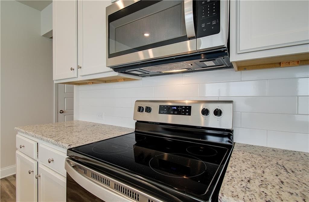 5 bedroom, 4 bathroom, 2,589 sq ft single family residence for sale at 21 Butternut Way, Auburn, GA 30011 — photo 7