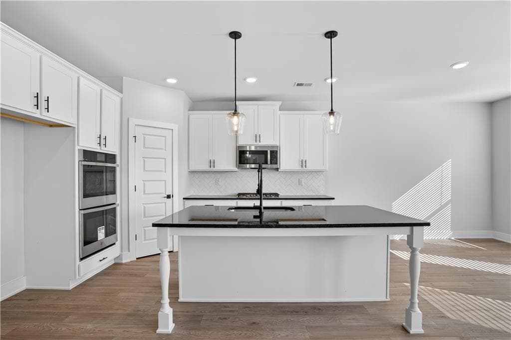 5 bedroom, 3 bathroom, 2,676 sq ft single family residence for sale at 407 Bass Circle LOT 36, Villa Rica, GA 30180 — photo 7