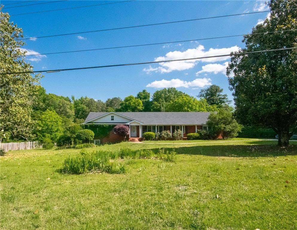 5 bedroom, 3 bathroom, 3,932 sq ft single family residence for sale at 6980 Rivertown Road, Fairburn, GA 30213