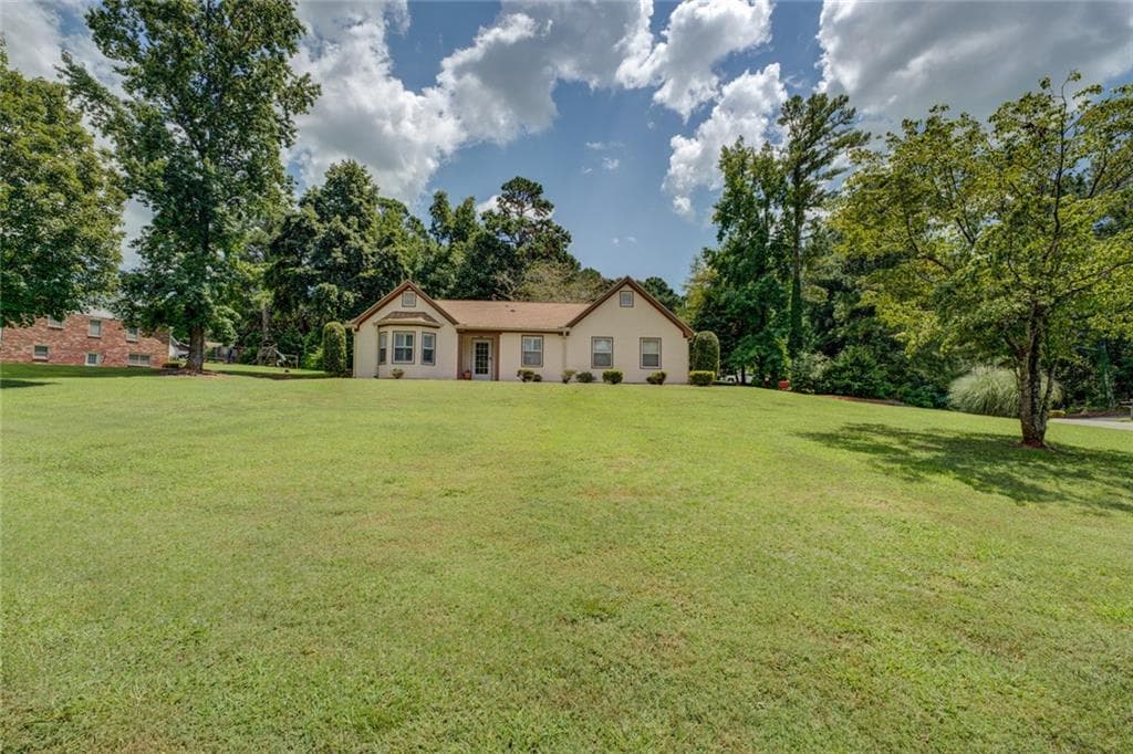 3 bedroom, 2 bathroom, 1,936 sq ft single family residence under contract at 4938 Lake Forest Drive, Conyers, GA 30094 — photo 2
