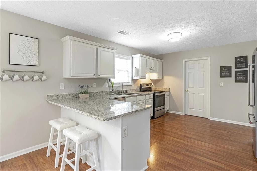 5 bedroom, 3 bathroom, 2,688 sq ft single family residence for sale at 1196 Adah Court, Lawrenceville, GA 30043 — photo 2