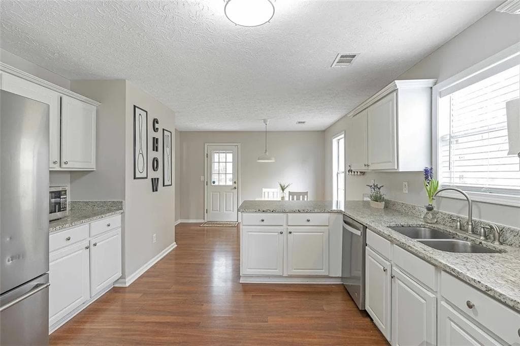 5 bedroom, 3 bathroom, 2,688 sq ft single family residence for sale at 1196 Adah Court, Lawrenceville, GA 30043 — photo 4