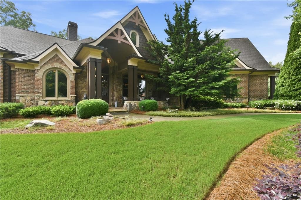 4 bedroom, 6 bathroom, 5,812 sq ft single family residence for sale at 5038 Pointer Ridge, Flowery Branch, GA 30542 — photo 2