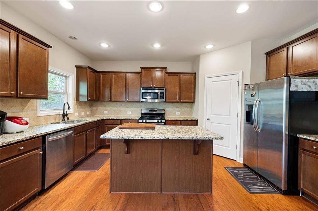 5 bedroom, 3 bathroom, 3,088 sq ft single family residence for sale at 440 Cranbrooke Circle, Suwanee, GA 30024 — photo 8