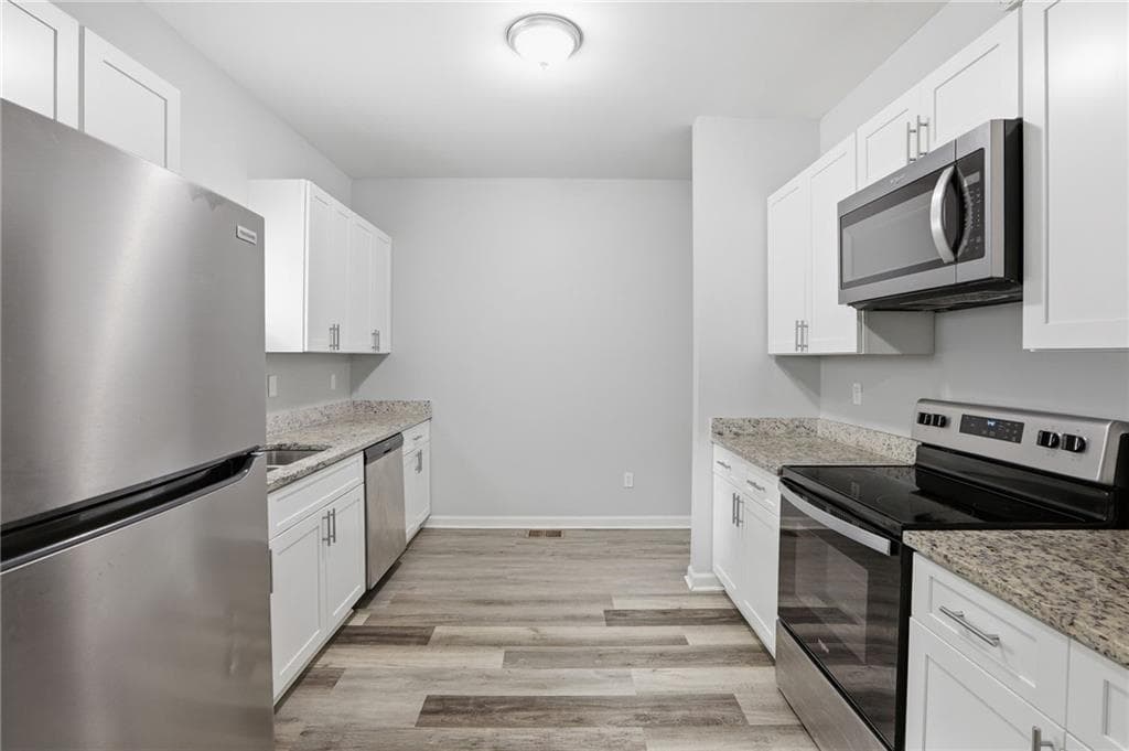 4 bedroom, 3 bathroom, 2,000 sq ft single family residence for sale at 820 Magna Carta Drive, Atlanta, GA 30318 — photo 9