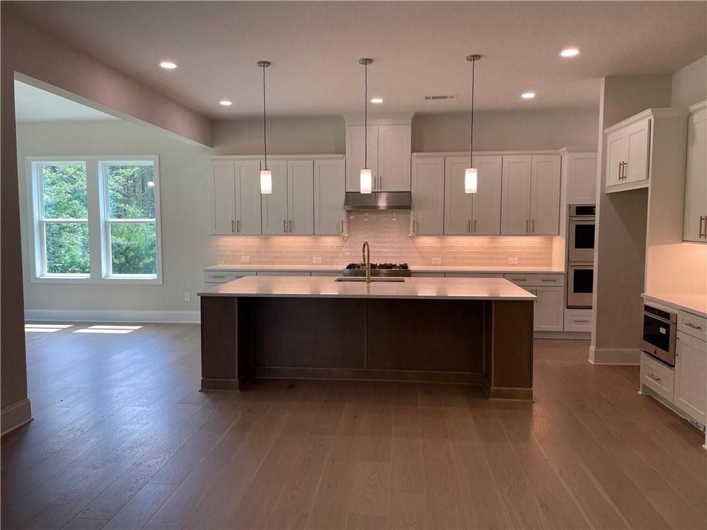 5 bedroom, 5 bathroom, 3,982 sq ft single family residence for sale at 7150 Pond View Drive, Cumming, GA 30028 — photo 4