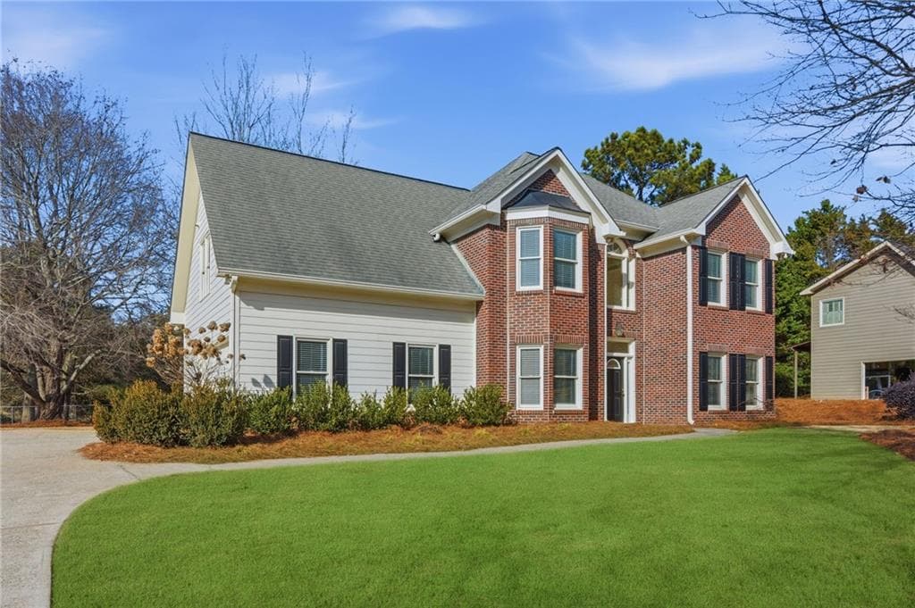 4 bedroom, 3 bathroom, 2,304 sq ft single family residence for sale at 2650 Cobblestone Drive, Cumming, GA 30041 — photo 2