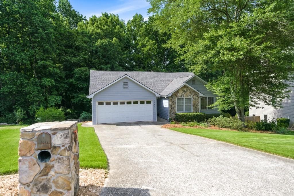 4 bedroom, 3 bathroom, 2,747 sq ft single family residence for sale at 2083 James River Cove, Suwanee, GA 30024 — photo 2