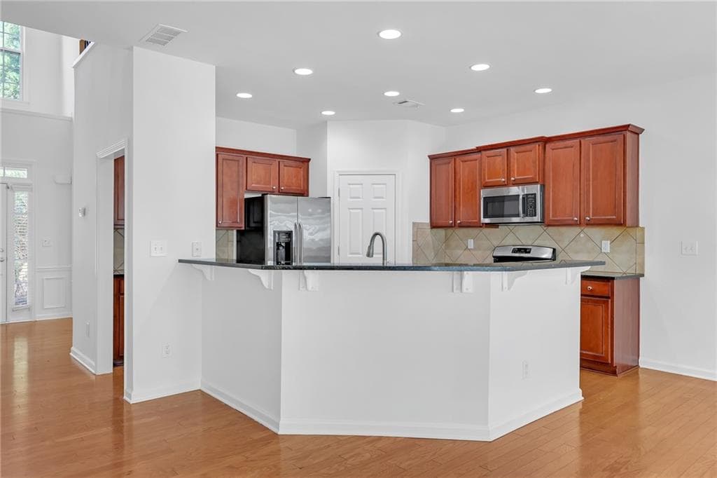 5 bedroom, 3 bathroom, 2,472 sq ft single family residence for sale at 5608 Avonley Creek Drive, Buford, GA 30518 — photo 7