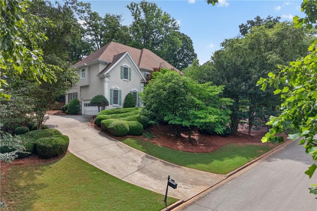 5 bedroom, 3 bathroom, 3,580 sq ft single family residence for sale at 1995 Woods River Lane, Duluth, GA 30097 — photo 1 of 37