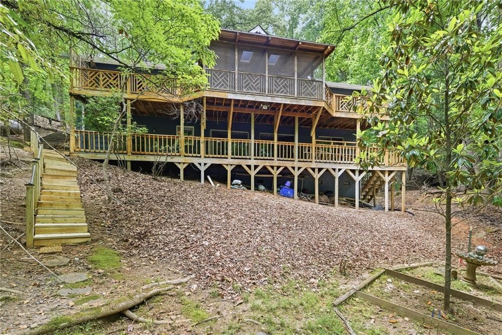 5 bedroom, 4 bathroom, 3,354 sq ft single family residence for sale at 7755 Kings Point Drive, Cumming, GA 30041 — photo 2
