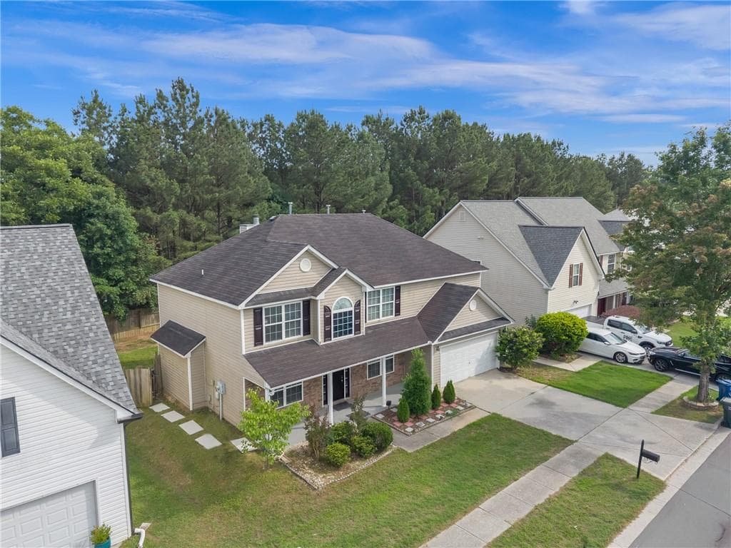 4 bedroom, 3 bathroom, 2,684 sq ft single family residence for sale at 4563 Grove Lake Street, Loganville, GA 30052 — photo 4