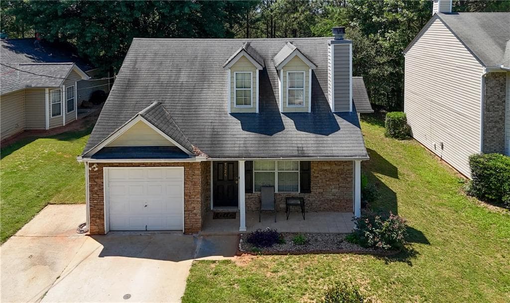 3 bedroom, 2 bathroom, 1,482 sq ft single family residence for sale at 7126 Ravenwood Lane, Lithonia, GA 30038 — photo 1 of 39