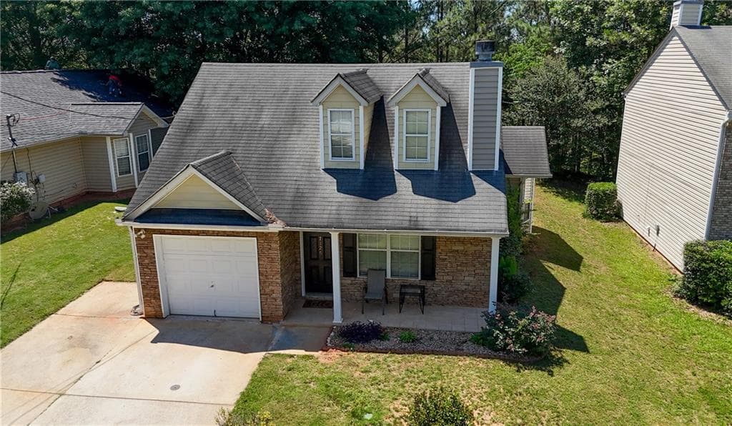 3 bedroom, 2 bathroom, 1,482 sq ft single family residence for sale at 7126 Ravenwood Lane, Lithonia, GA 30038 — photo 2