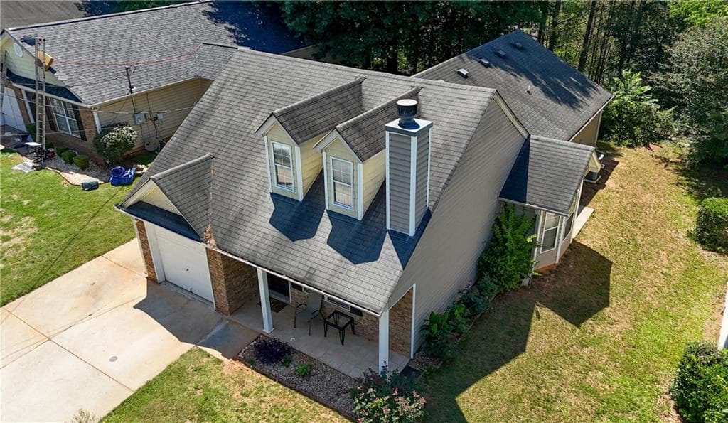 3 bedroom, 2 bathroom, 1,482 sq ft single family residence for sale at 7126 Ravenwood Lane, Lithonia, GA 30038 — photo 3